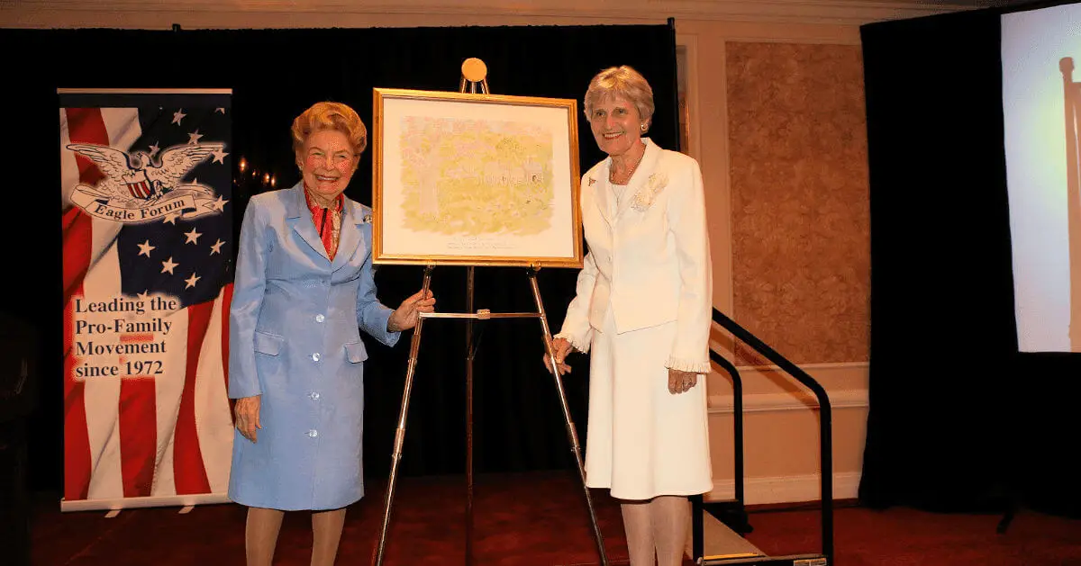 Phyllis Schlafly presents Eunie Smith with the Eagle Forum Homemaker Award