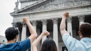 Men and a Woman Protesting in Front of the Supreme Court of the United States