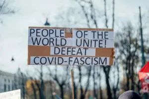 Sign at vax mandate protest