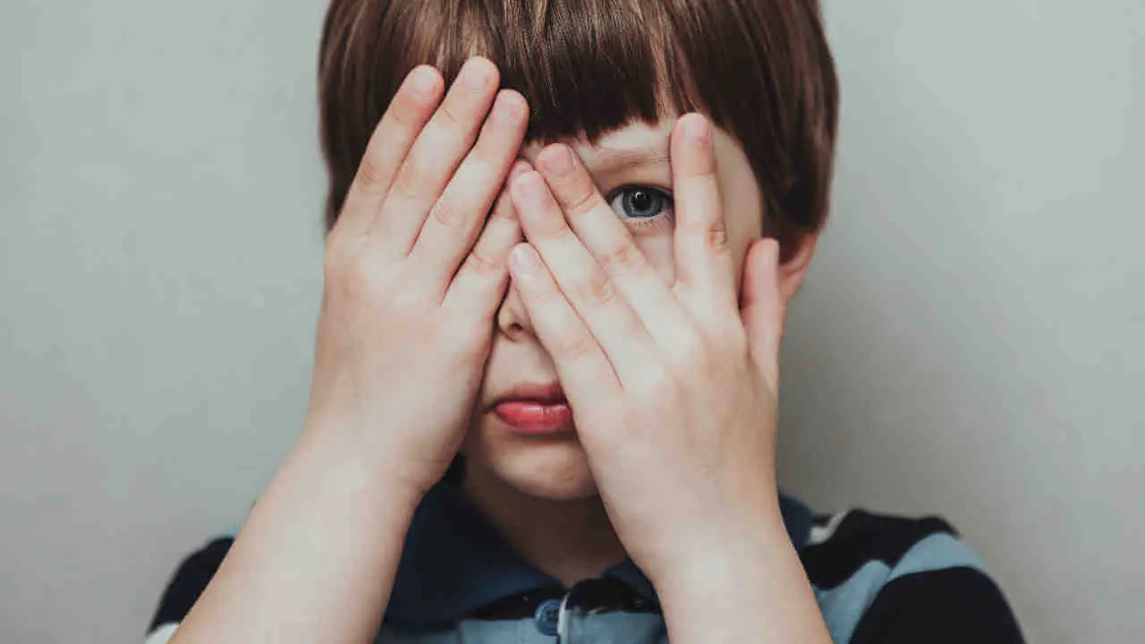 Child Hiding eyes