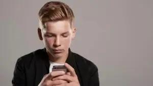 boy looking at mobile phone